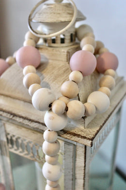 Farmhouse bead garland in pink, cream and natural colors. Bead sizes vary